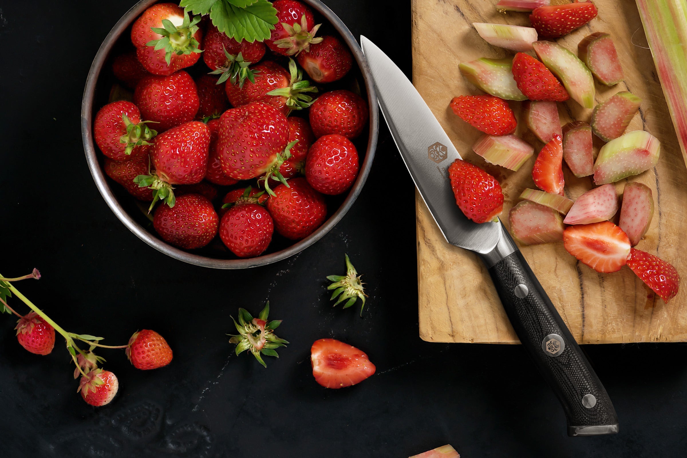The Dynasty Paring Knife slicing strawberries and rhubarb.