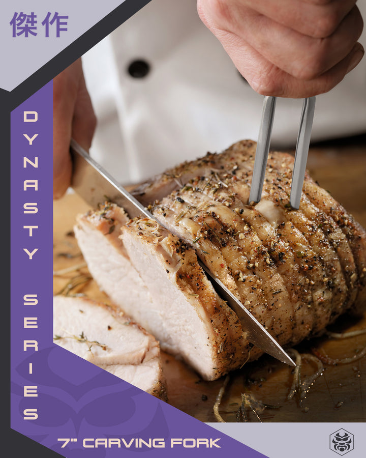 A chef carves thick cuts of chicken with the Dynasty Carving Fork