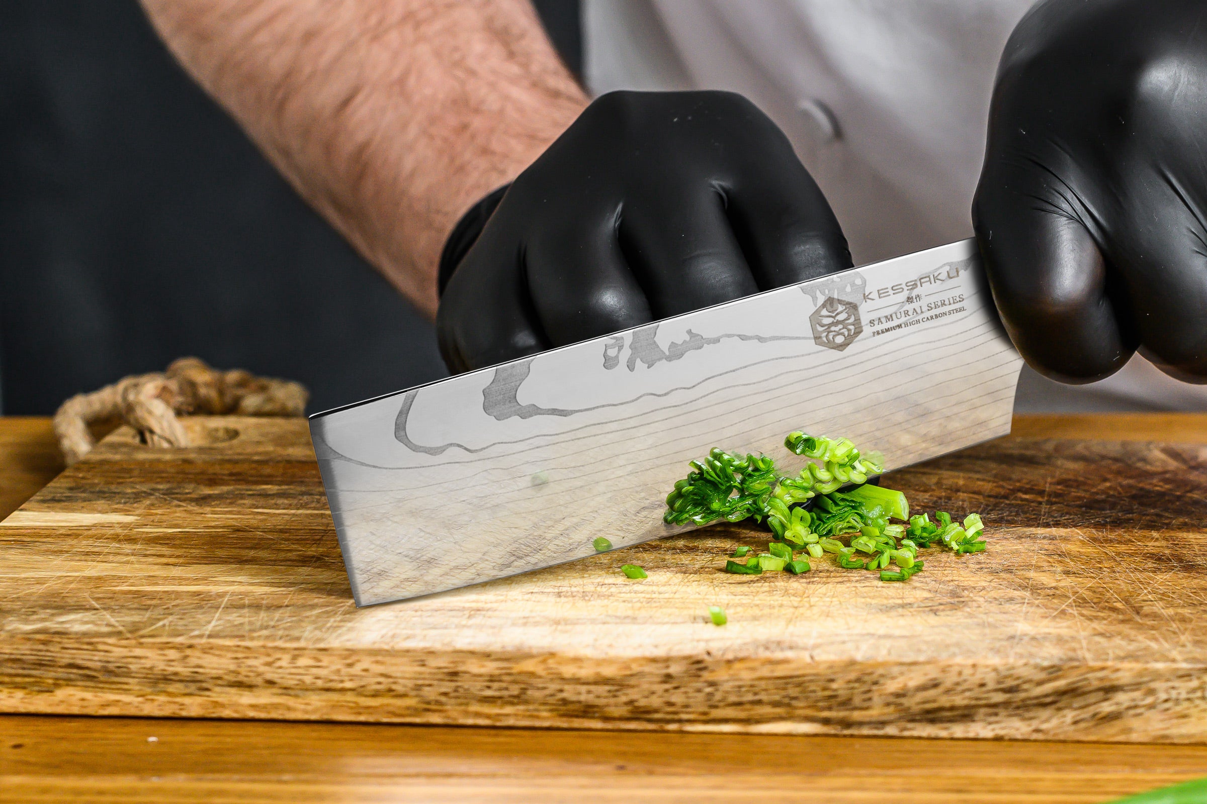 A chef mines green onion with the Samurai Produce Knife