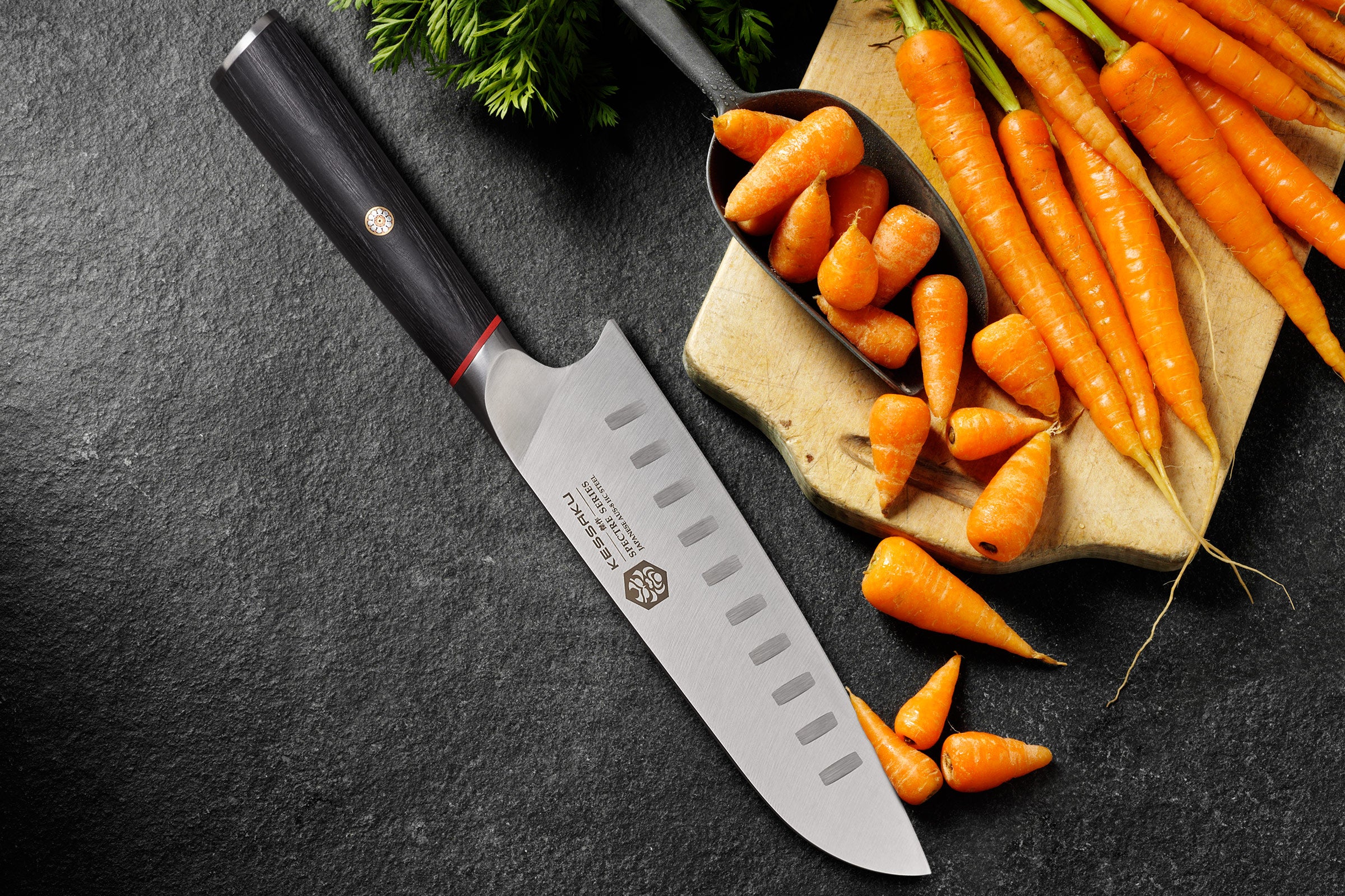 The Spectre Santoku ready to slice a bunch of carrots.