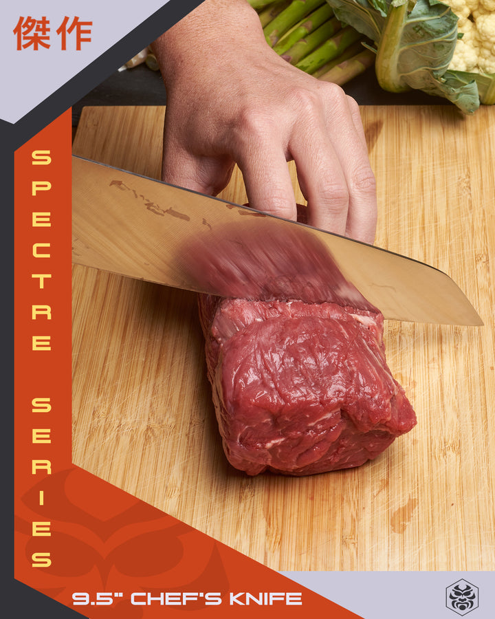 A woman slices a filet mignon with the Spectre K-Tip Chef's Knife. Cauliflower and asparagus are in the background.