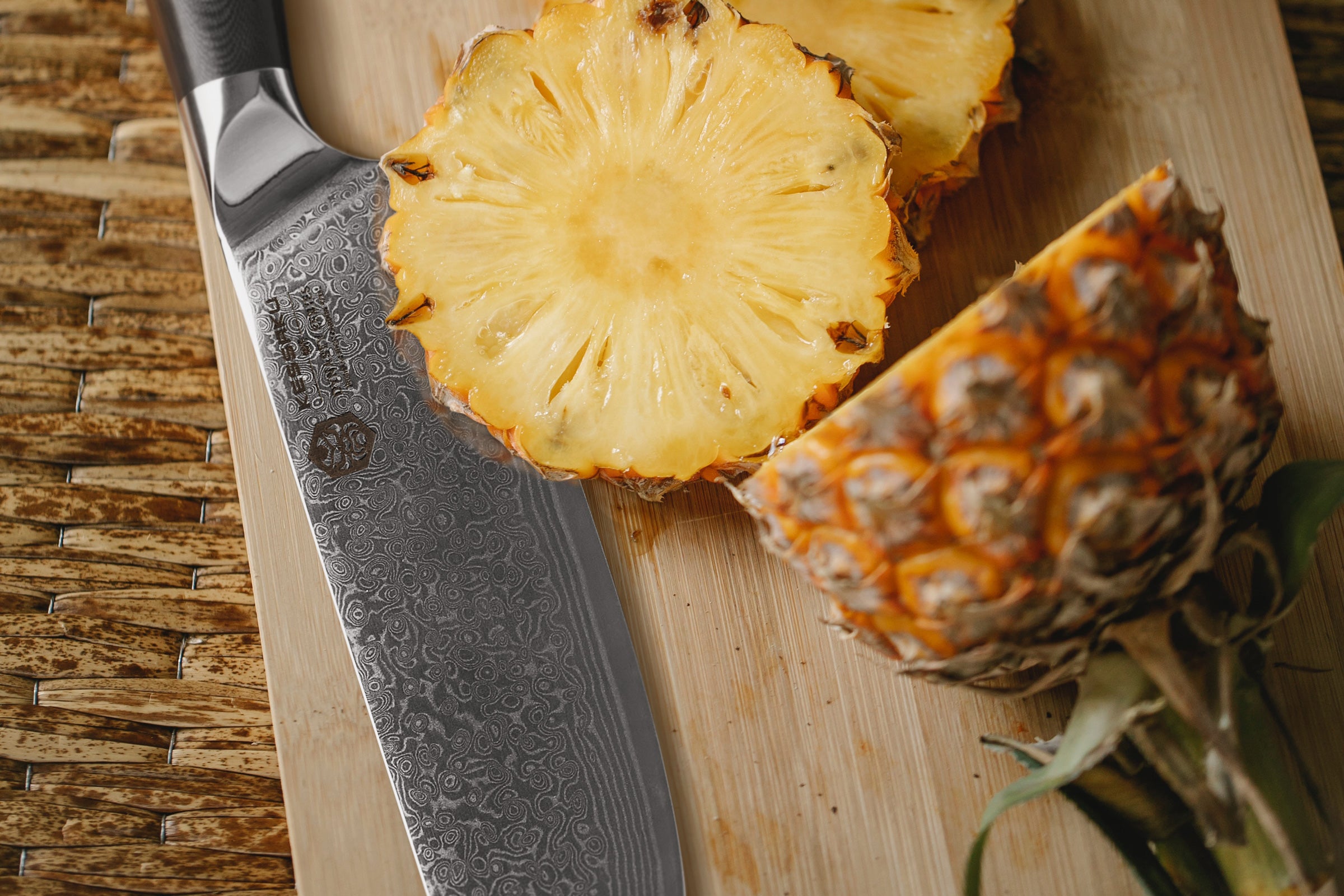 The Dynasty Damascus Nakiri with thick slices of pineapple.