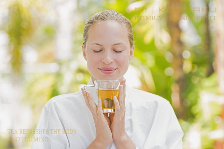 A woman breathes in steeping tea while on a retreat