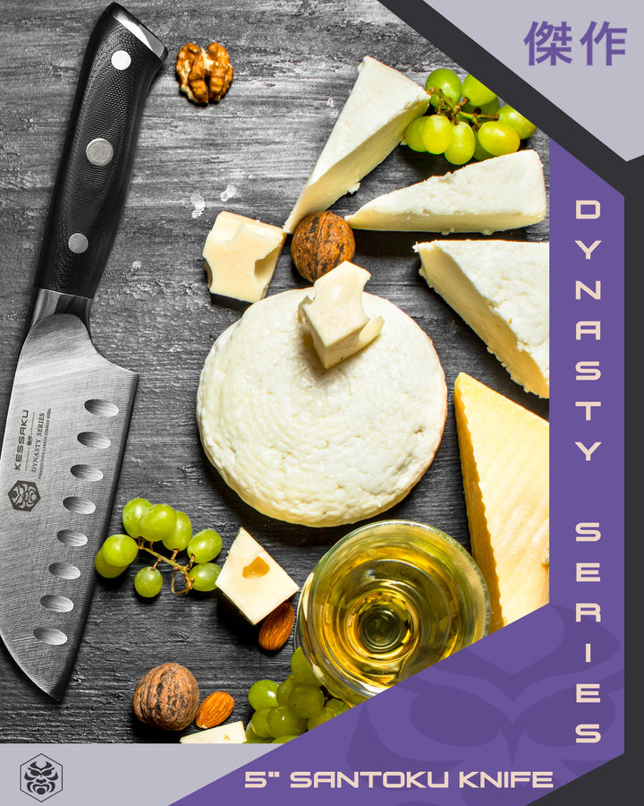The Dynasty Santoku with an assortment of sliced cheeses, grapes, walnuts, and white wine.