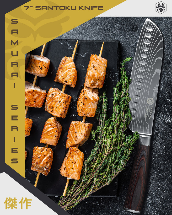 The Samurai Santoku Knife next to skewered chunk of salmon and sprigs of rosemary