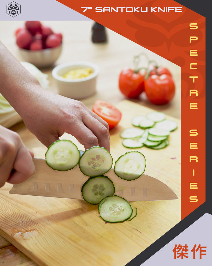 A woman slices cucumber with the Spectre Santoku Knife