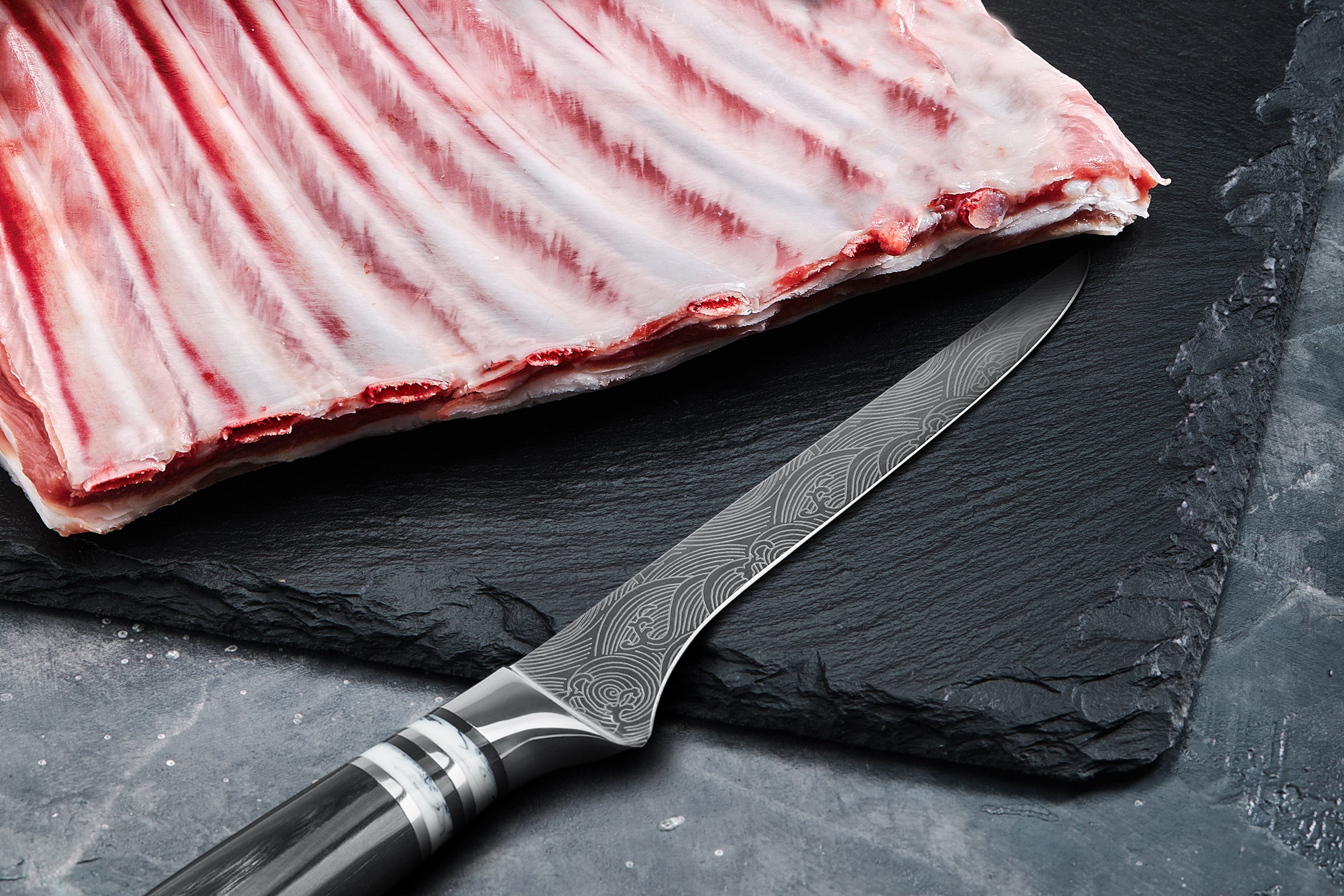Getting the Ronin Boning Knife ready to slice through a large rack of ribs.