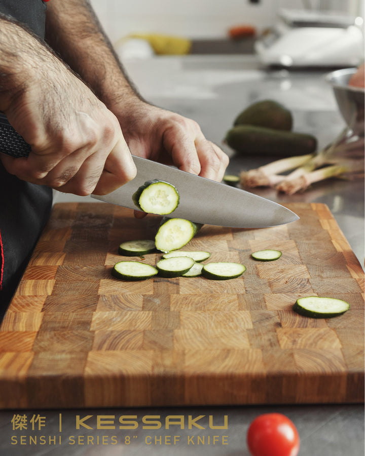 A coook slices cucumber with the Senshi Chef's Knife