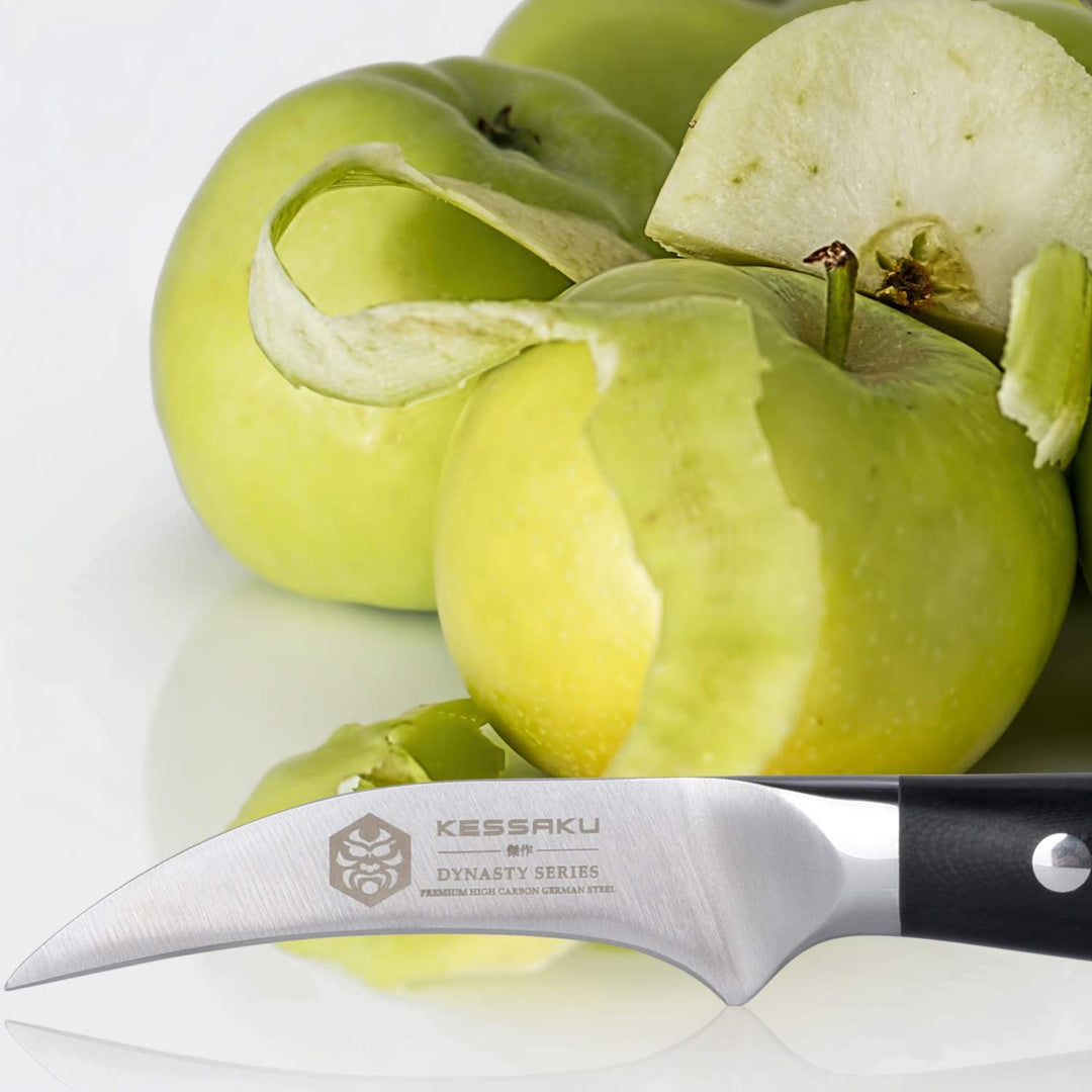 The Dynasty Tourne Paring Knife with peeled apples