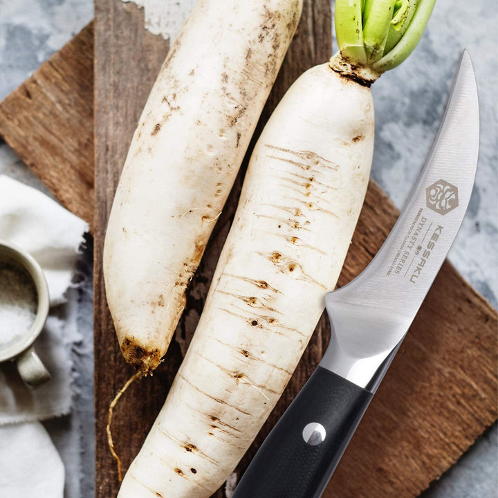 The Dynasty Tourne Knife next to root vegetables