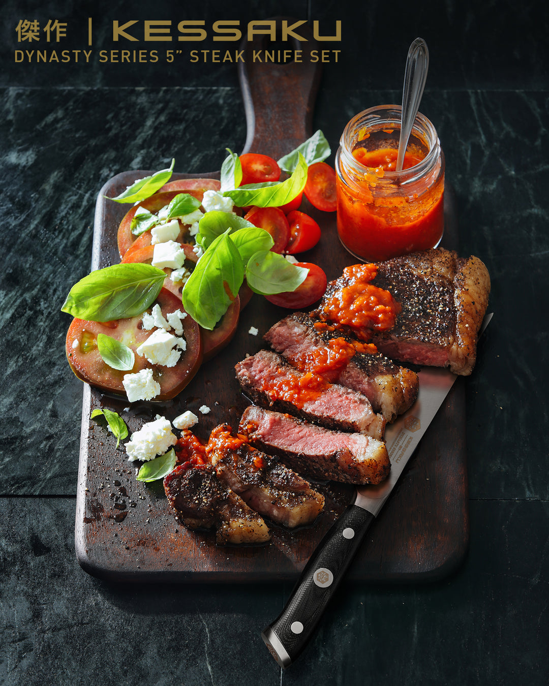 A Dynasty Steak Knife with slices of steak and tomato, basil, crumbled feta and chutney