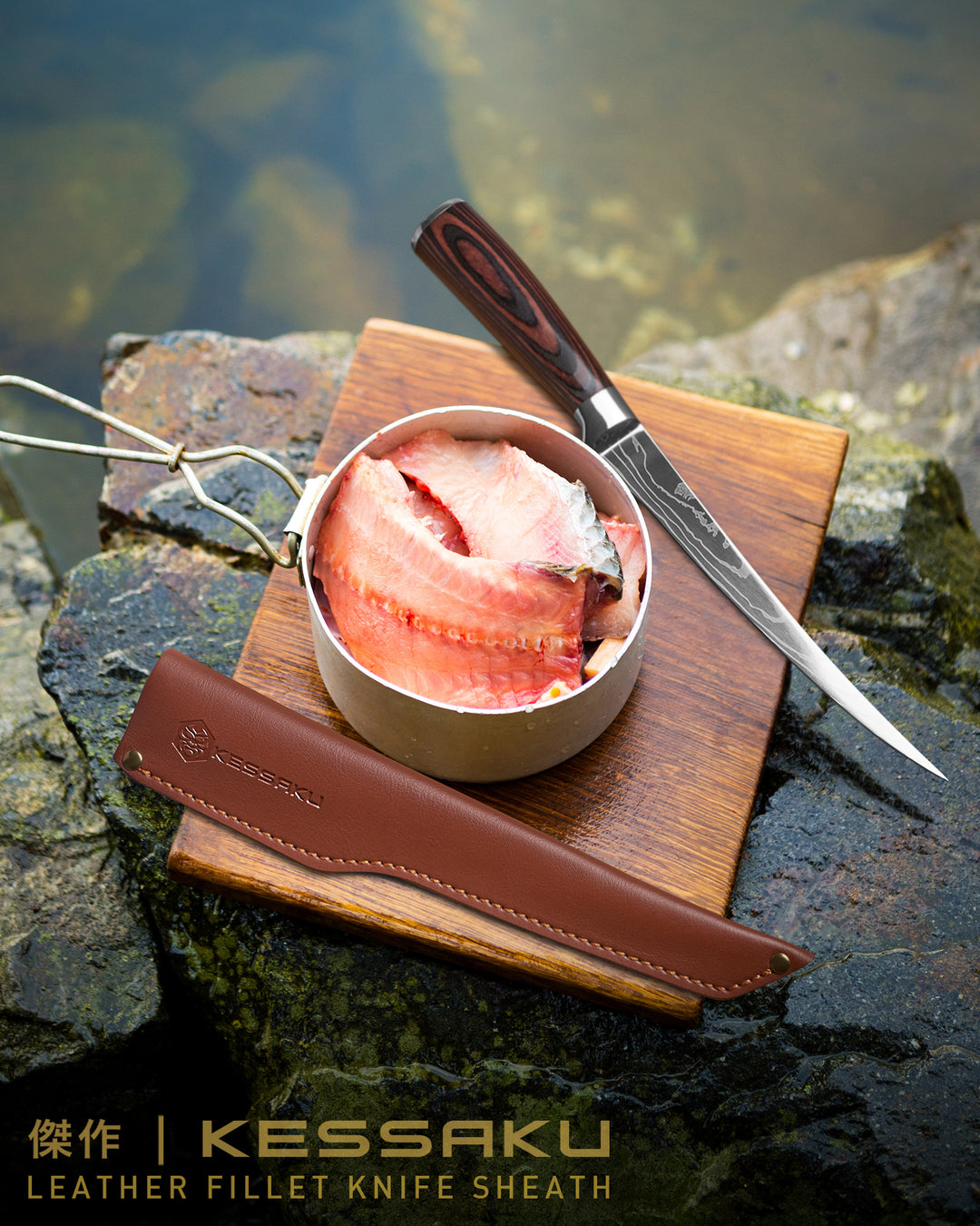 A filleted fish in a pot next to the Samurai Fillet Knife and Kessaku Leather Knife Sheath along the rocky banks of a river.