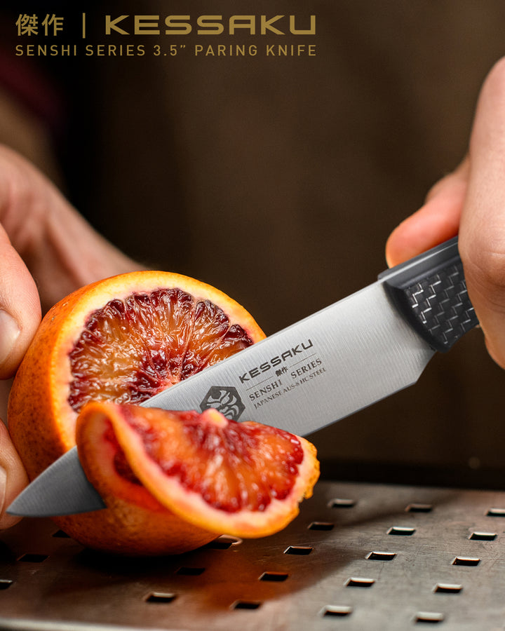 A chef slices a blood orange with the Senshi Paring Knife